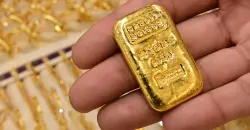 Gold slips on firm dollar, index rebalancing ahead of US jobs data