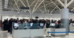 First stranded Iraqis arrive home as Baghdad plans more evacuations