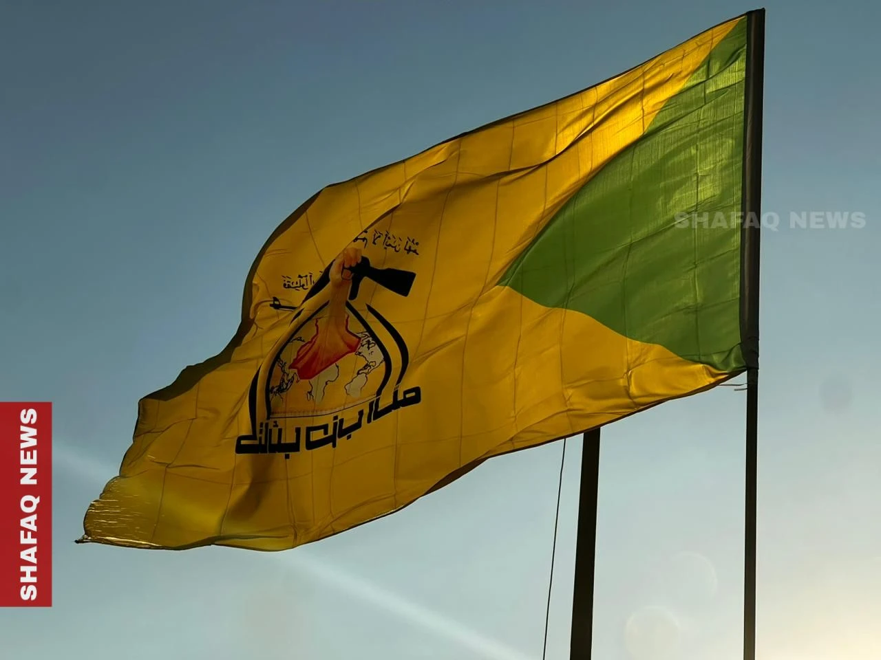 Kataib Hezbollah raises flags across Baghdad streets and bridges