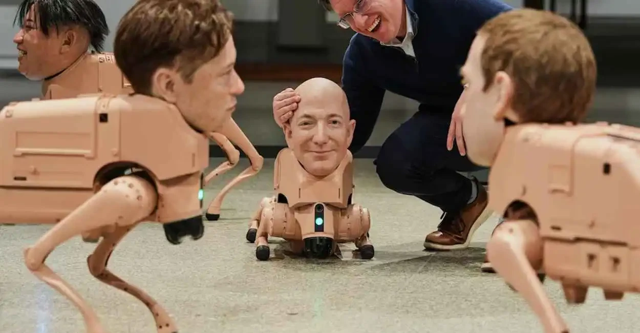 كلاب روبوتية بوجوه ماسك وبيزوس في معرض فني يشعل الجدل ببرلين