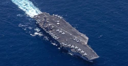 Iran warns vessels in Hormuz while US boosts military posture