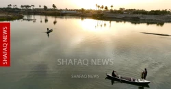 Iraqi fishermen work Euphrates waters in Babil at sunset