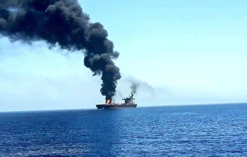 Iran reports loaded tanker hit, US threatens whole fleet