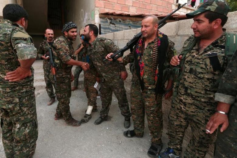 U.S.-allied Kurd militia says struck Syria base deal with Russia