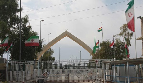 Iraqi protesters block a road leading to a border crossing with Iran