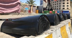 صور.. متظاهرو التحرير يتحصنون بدروع
