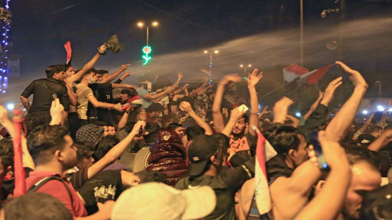 Demonstrators dispersed with live bullets and two clans control a bridge in southern Iraq