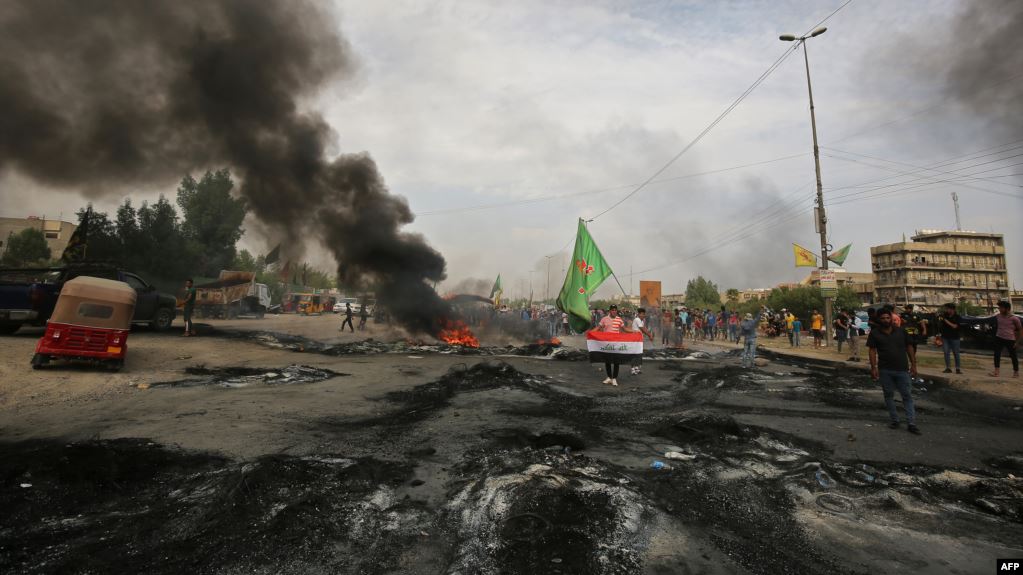 11 قتيلا وجريحا واحتراق همرين عسكريتين باحتجاجات جديدة بالنجف وبغداد