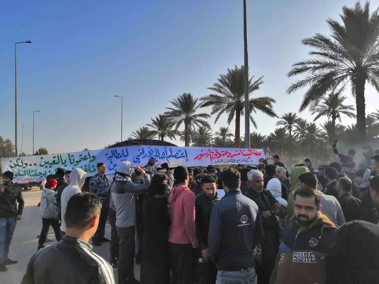 Protesters close a port in Basra and detain employees by shutting down a power station in Karbala