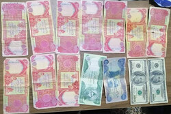 اعتقال عصابة من اسرة واحدة بحوزتهم اموالا مزيفة دولار ودينار بإقليم كوردستان
